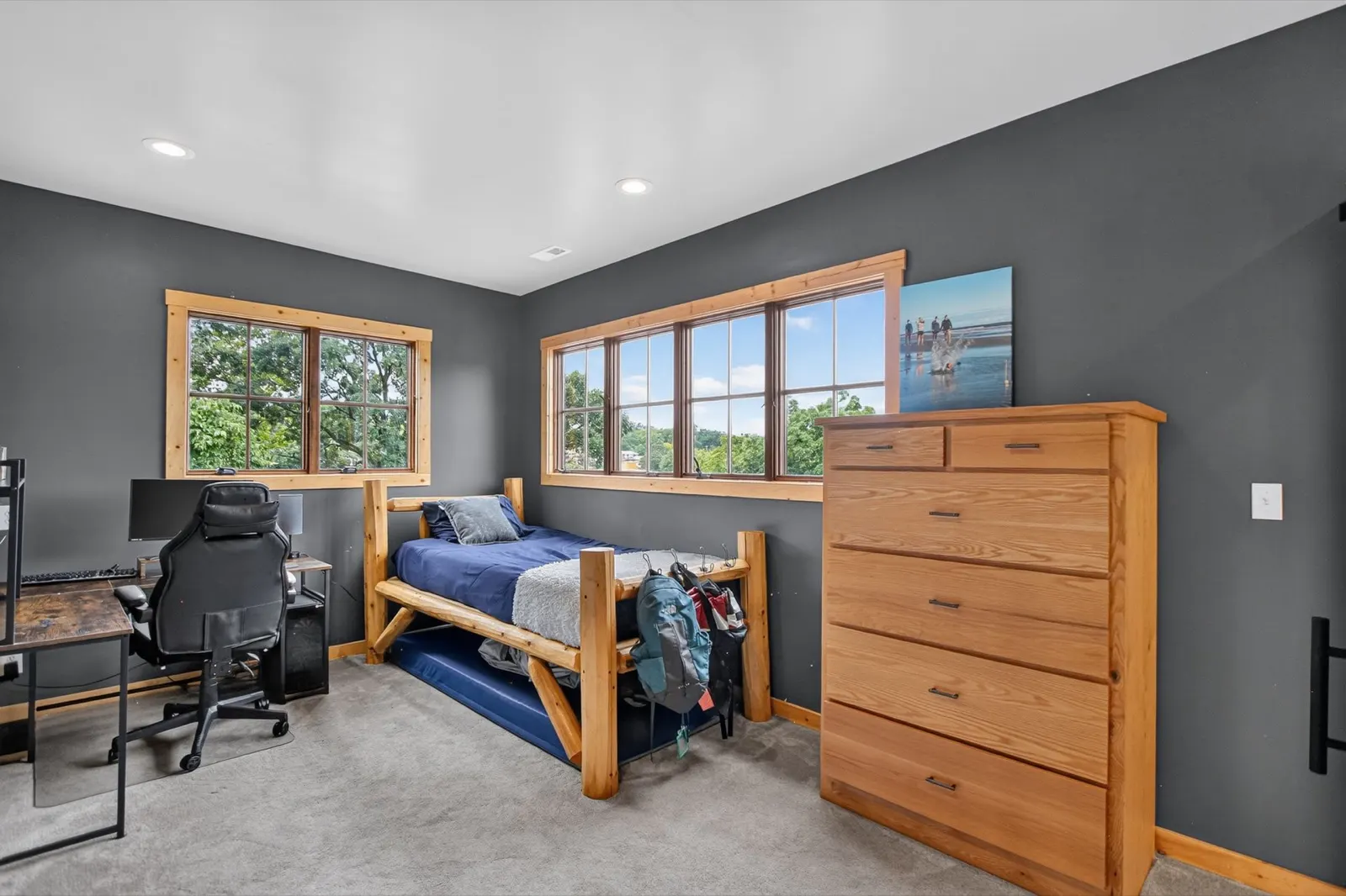 Bedroom with log-frame twin bed and trundle at 31 H Street, Lake Lotawana