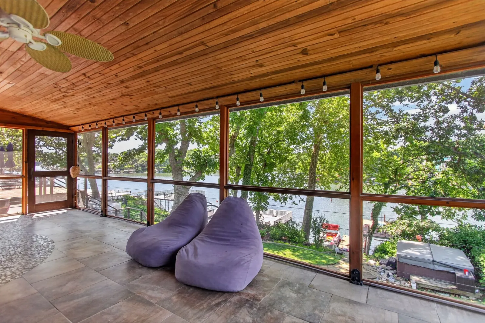 Screened porch with lake view and seating at 31 H Street, Lake Lotawana