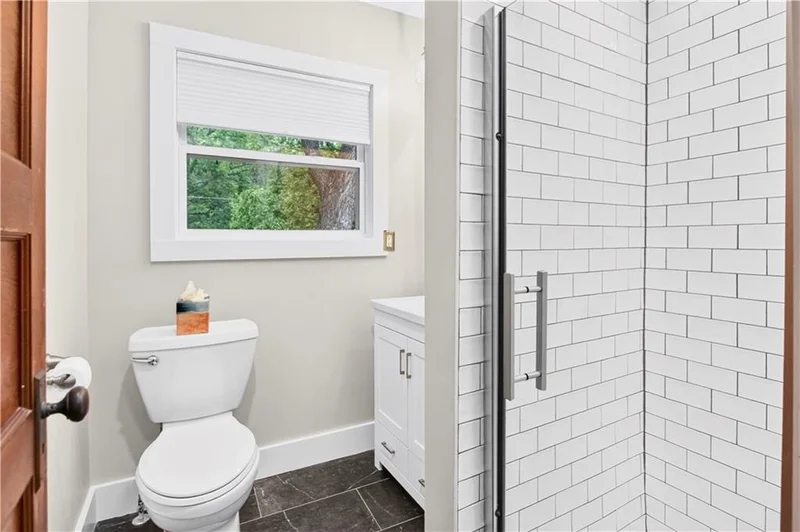 Remodeled bathroom with a glass-enclosed shower