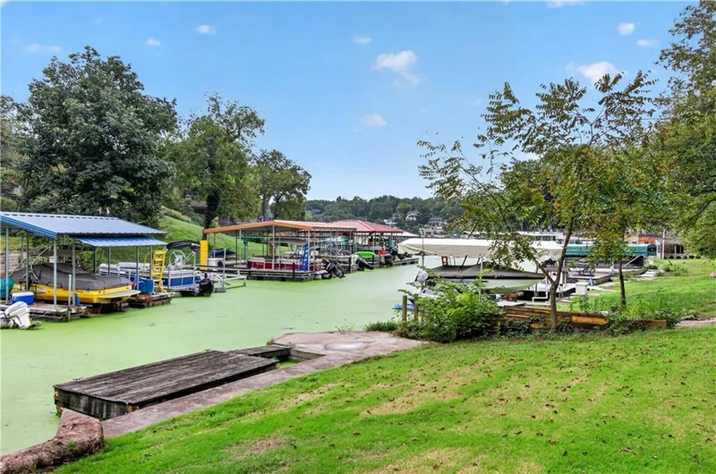 The lawn running down to the cove